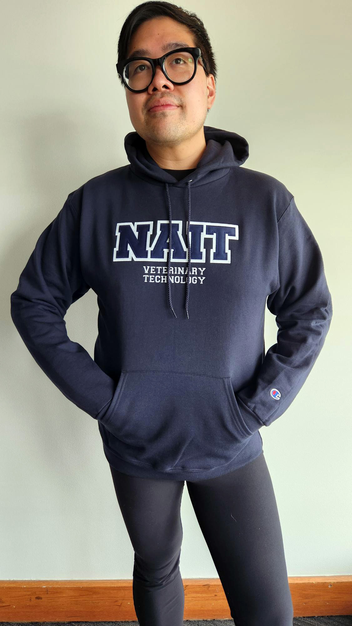 NAIT Student Wearing Program Campus Hoodie
